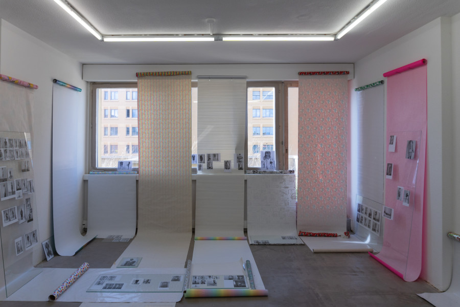 Exhibition view, Sven Gex, celebratory, Halmet, Zürich, 2025. Sven Gex, celebratory, 2025, gift wrapping paper, nails, glass, printed images from the ‚character fitting‘ series 2021-ongoing