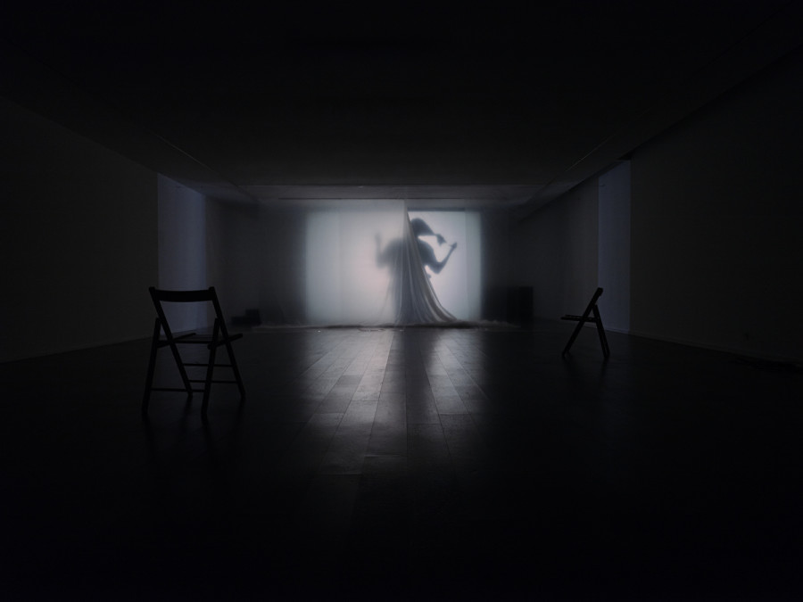 Exhibition View, ‘Stitches: A Haunted House and Other Ghost Stories’ at the Villa Bernasconi, 2026 / Photo by Nicolas Delaroche Studio. Sandar Tun Tun, Light.wav, 2026, audiovisual installation, 18’ (loop), 4.1 multichannel sound, projection, plastic, scent. With the participation/contribution of Elie Autin, Meryam Benbachir, Deborah E. Macauley