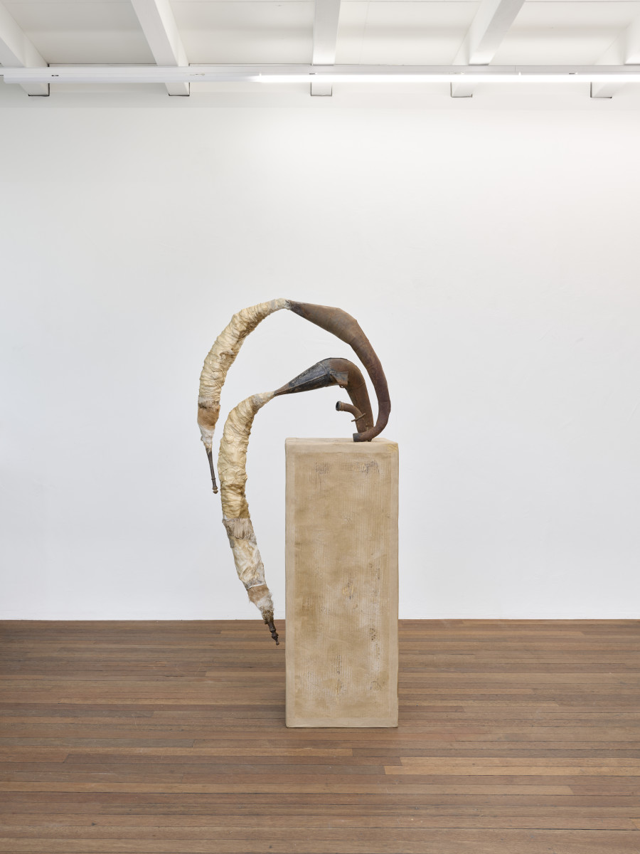 Mónica Mays, Feeding, falling, flying II, 2025, Found exhaust system, vellum, wax, cardboard, wood, 142 x 67 x 66 cm. Blue Velvet, Zurich, Switzerland, 2025, Photo: Felix Jungo