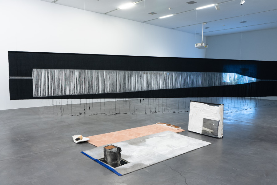 Exhibition view Thea Djodjadze, His Vanity Requires No Response, 2011, carpet, plaster, clay, metal, wood, mirror, paint, india ink, wire, Yael Davids, Vanishing Point, 2020, Carpet, plaster, clay, metal, wood, mirror, paint, india ink, wire, Heidi Bucher, Bodys- hells, 1972, single-channel video on monitor or projection (16 mm film transferred to digital, color, sound). Sammlung Migros Museum für Gegenwartskunst. Photo: Studio Stucky, copyright Thea Djodjadze, Yael Davids and The Estate of Heidi Bucher