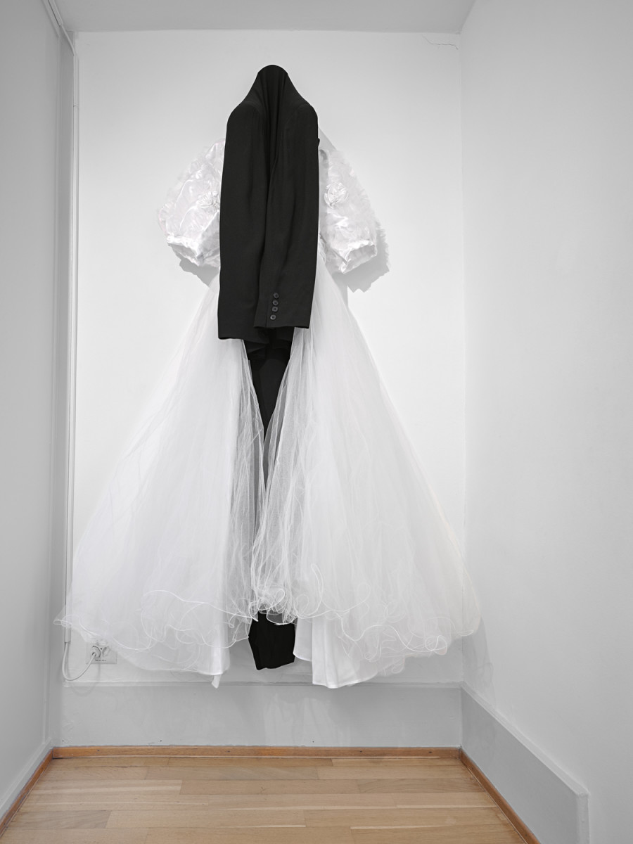 Exhibition View, ‘Stitches: A Haunted House and Other Ghost Stories’ at the Villa Bernasconi, 2026 / Photo by Nicolas Delaroche Studio. Gotscho, Wedding 1, 1992, acetate, wool, nylon (Tati dress, agnès b. cos- tume), Coll. MAMCO, « Autour de Gilles Dusein », thanks to the support of the artist, Serge Aboukrat, Christian Bernard and Caroline Bourgeois