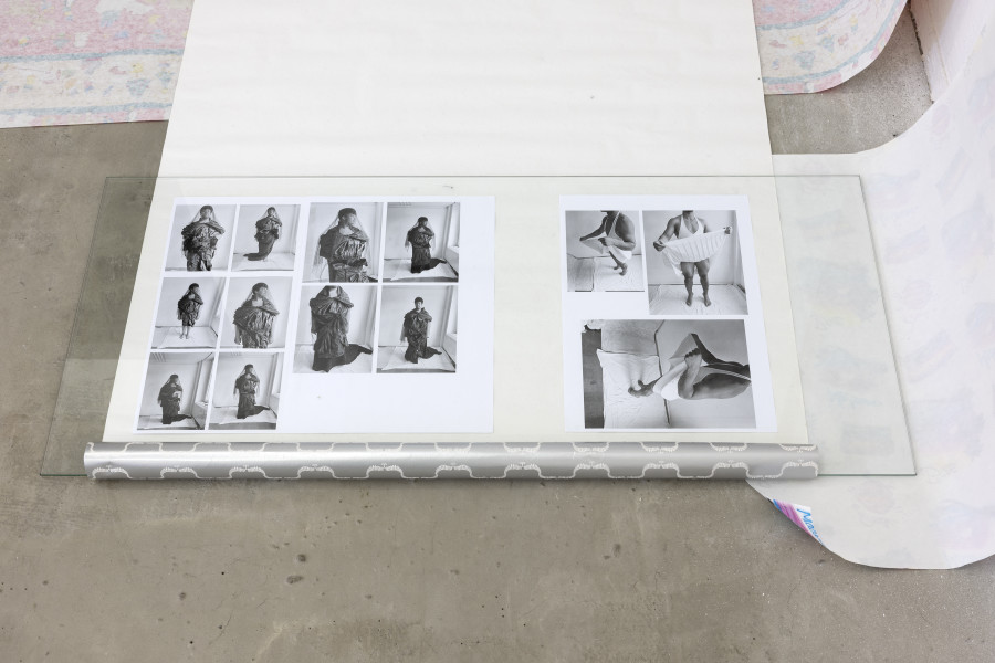 Exhibition view, Sven Gex, celebratory, Halmet, Zürich, 2025. Sven Gex, celebratory, 2025, gift wrapping paper, nails, glass, printed images from the ‚character fitting‘ series 2021-ongoing