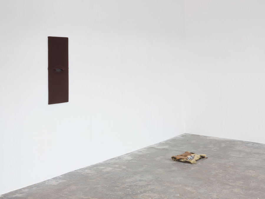 From left to right: Hélène Janicot, Untitled, 2025, pullover, wood, 80 × 32cm. Hélène Janicot, Untitled, 2025, insulation foam, photograph on bark, 45 × 35cm. © Sebastien Verdon