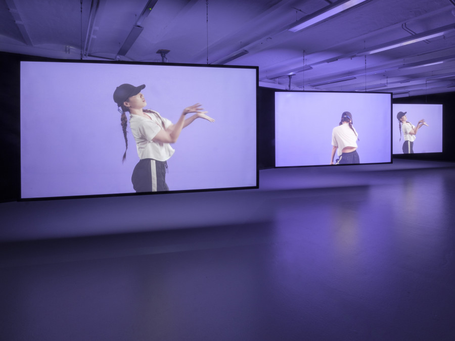 Hwayeon Nam, Throbbing Dance, 2017, three channel video 10’57’’, exhibition view at CAN Centre d’art Neuchâtel, 2025. Photography: Sebastian Verdon. Courtesy: All images courtesy of Hwayeon Nam and CAN Centre d’art Neuchâtel
