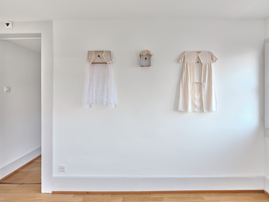 Exhibition View, ‘Stitches: A Haunted House and Other Ghost Stories’ at the Villa Bernasconi, 2026 / Photo by Nicolas Delaroche Studio. From left to right and front to back: Claire van Lubeek, Cradled – Lace, 2026, cardboard, lace, forged nail. Claire van Lubeek, Cradled – Headpiece, 2026, cardboard, silk and lace, forged nail. Claire van Lubeek, Cradled – Cream, 2026, cardboard, silk, lace, forged nail