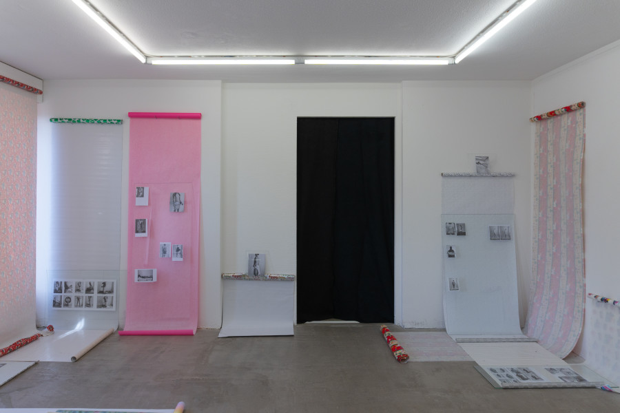 Exhibition view, Sven Gex, celebratory, Halmet, Zürich, 2025. Sven Gex, celebratory, 2025, gift wrapping paper, nails, glass, printed images from the ‚character fitting‘ series 2021-ongoing