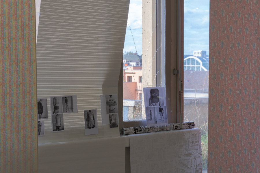 Exhibition view, Sven Gex, celebratory, Halmet, Zürich, 2025. Sven Gex, celebratory, 2025, gift wrapping paper, nails, glass, printed images from the ‚character fitting‘ series 2021-ongoing