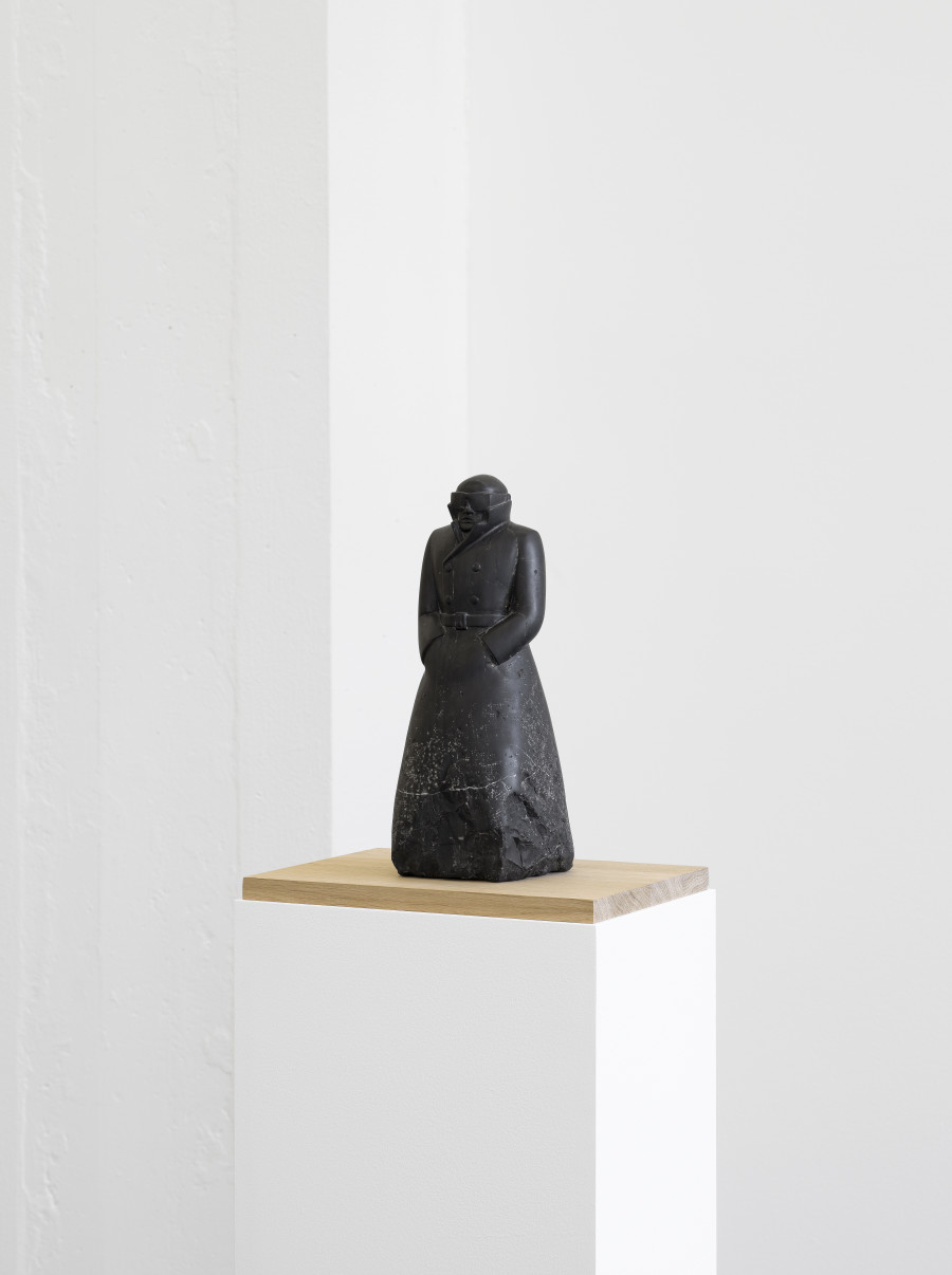 Installation view, Markus Raetz, Strangers & Lovers, Galerie Francesca Pia, 2025. Markus Raetz, Schwarzer Mann (Black Man), Carona/Bern/Mur (Vully-les-Lacs), 1976/1977, Limestone from Saint-Triphon, worked with hammer and chisel, bush hammer, carborundum, Japanese knife, and sandpaper, 33 x 13 x 13 cm. Photo: Cedric Mussano