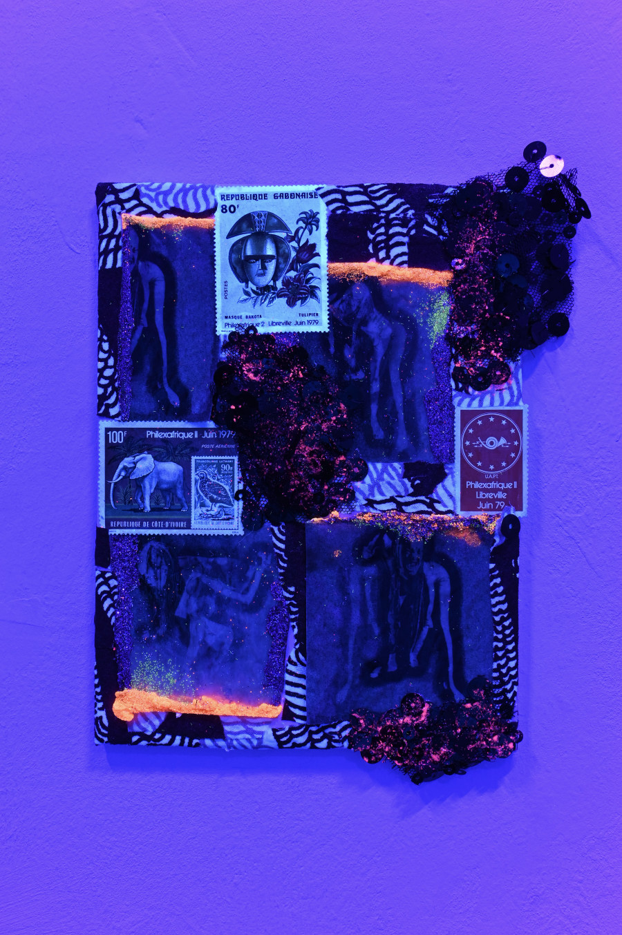 "Penny Black," 2024, mixed media on ceramic tiles including stamps and fabric, 14,5 x 14 cm. "Shi Deh Deh" by Jasmine Tutum at Kaiserwache, Freiburg im Breisgau, 2026. Photo by Stefan Lux.